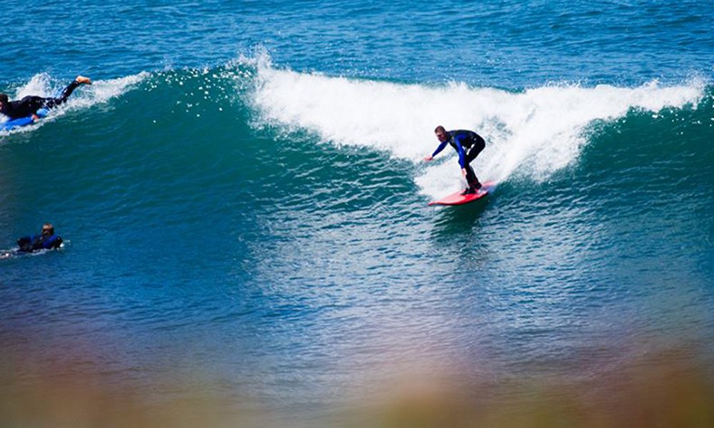 Surf beginner on a green wave.