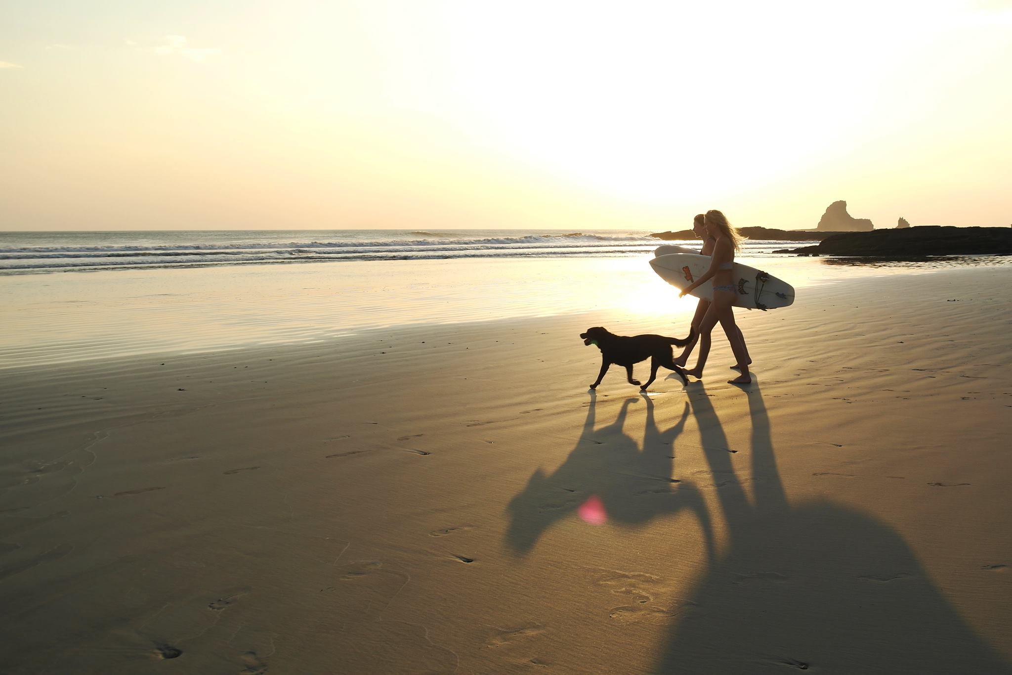 Girls sunset surf in Nicaragua