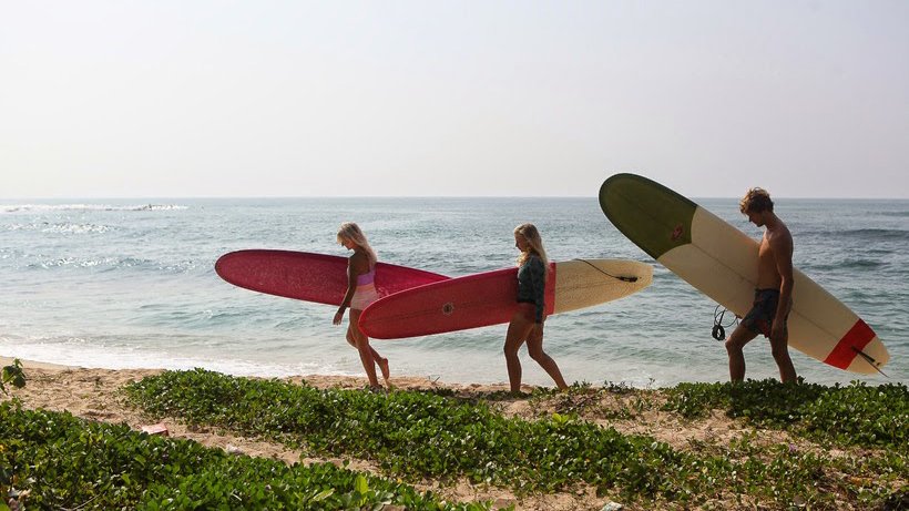 Girls longboarding and surfing in sri lanka