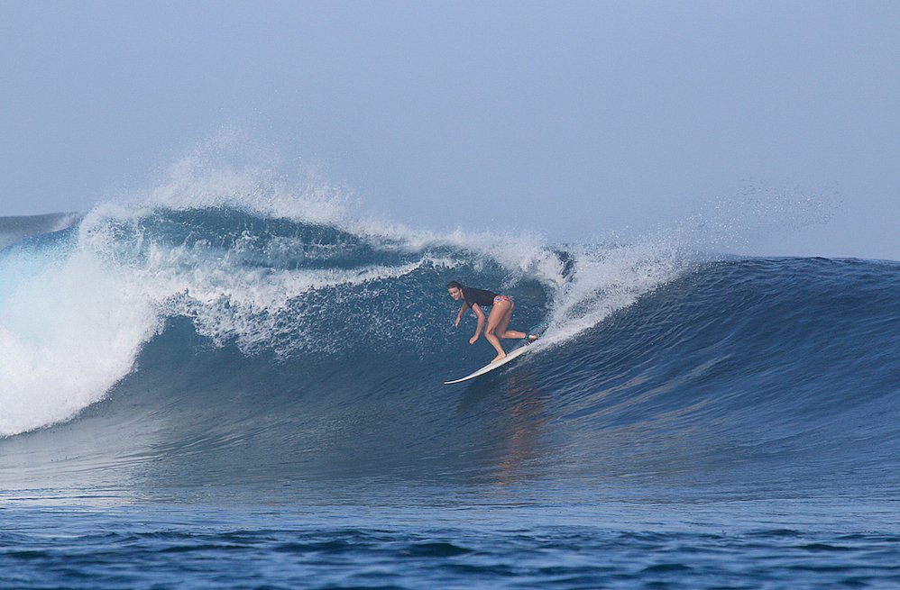 Female surfer in the Mentawais